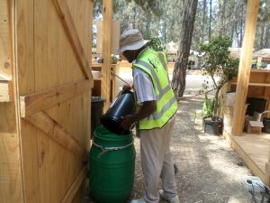 Madam Waste collecting organic and food waste at the Corona Sunsets Festival 2023 in Cape Town.
