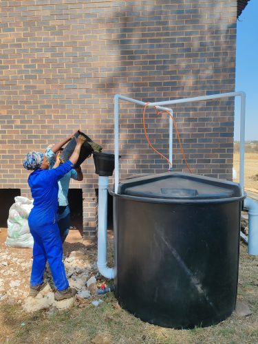 Organic waste is tipped into a biogas digester, where it is transformed into compost and renewable energy.